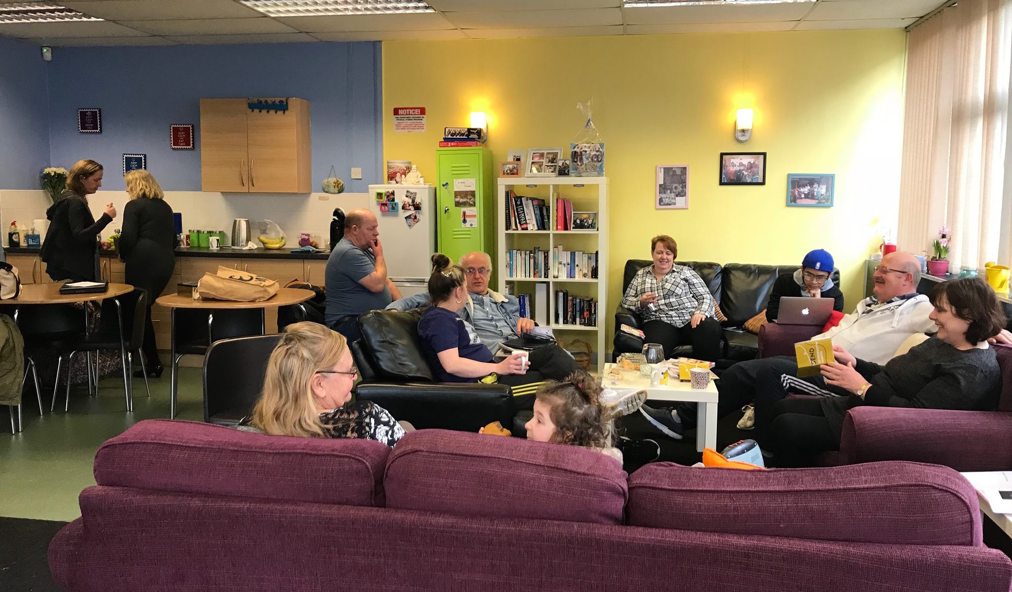 A group of parent-carers chatting and having a good time in Lifted carers' centre