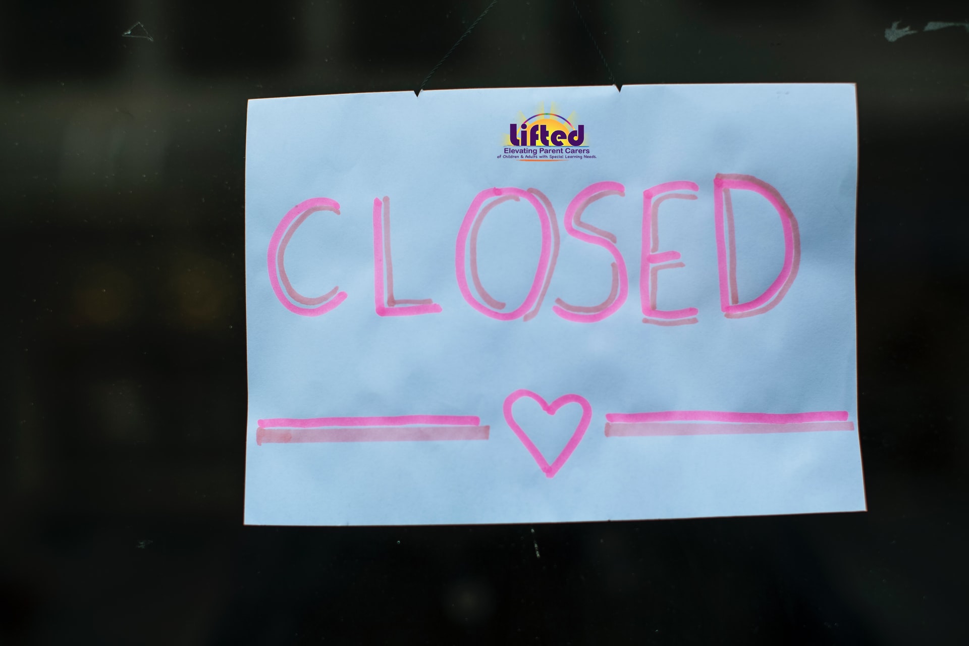 A sign saying 'Closed' with a drawing of a heart and Lifted's logo | Photo Credit: Markus Spiske on Unsplash
