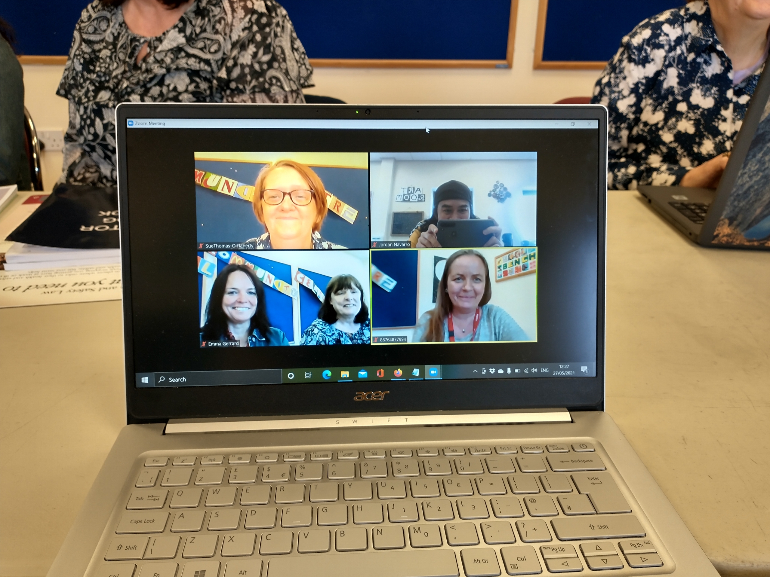 a laptop showing the Lifted team in a Zoom chat