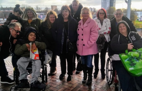 group photo of parent-carers on their way to The Lowry Outlet Mall