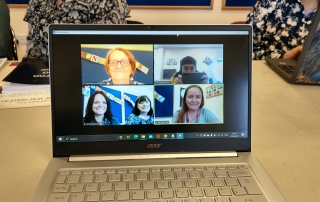 a laptop showing the Lifted team in a Zoom chat